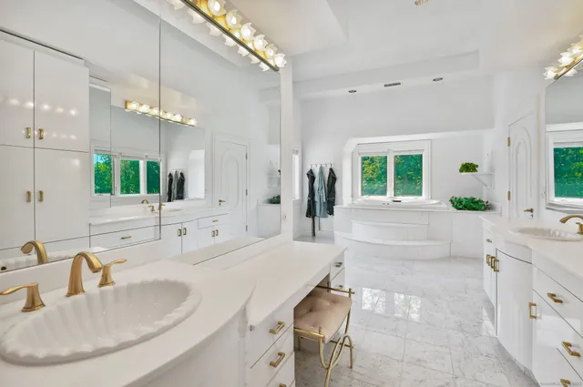 a view of a room with a window and a kitchen space