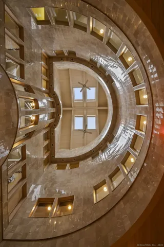 a living room with lots of furniture and kitchen view