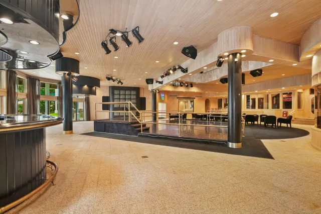 a view of a lobby with black carpet