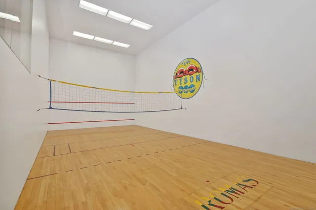 a roof deck with table and chairs