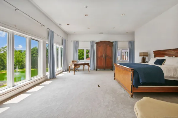 a view of a room with a window and a kitchen space