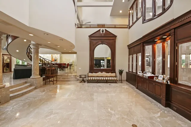 a view of living room with furniture and a fireplace