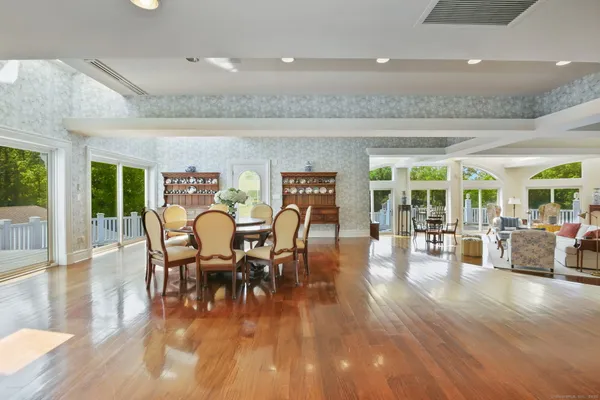 a view of a dining room with furniture window and wooden floor