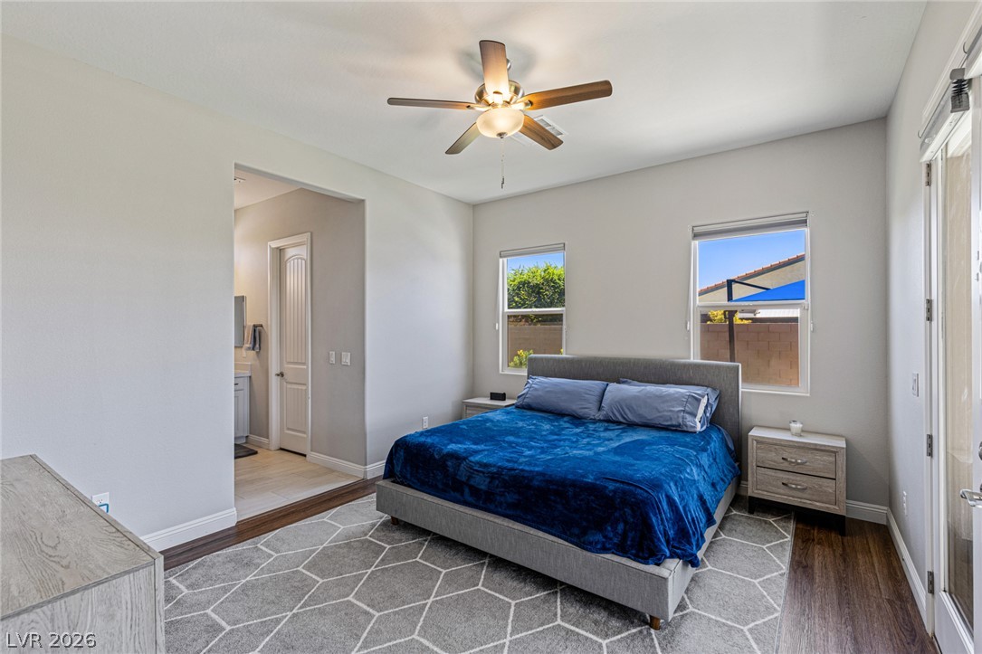 7036 Arabian Ridge Street Las Vegas, NV 89131 - Photo 43 of 64 Large Bedroom 5 with Walk-in closet, ceiling fan and French doors leading out to the covered patio.