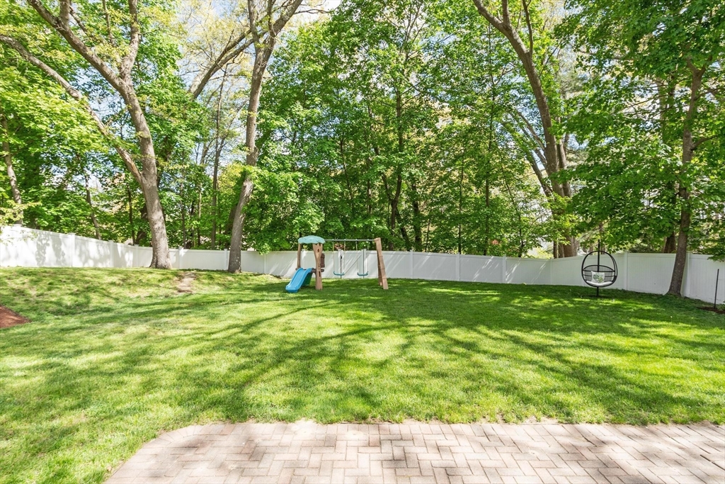 56 Old Marlboro Road Concord, MA 01742 - Photo 27 of 34 a backyard of a house with lots of green space