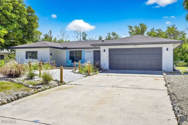 a front view of house with outdoor seating