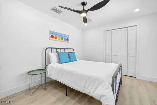 a bedroom with a bed and a table