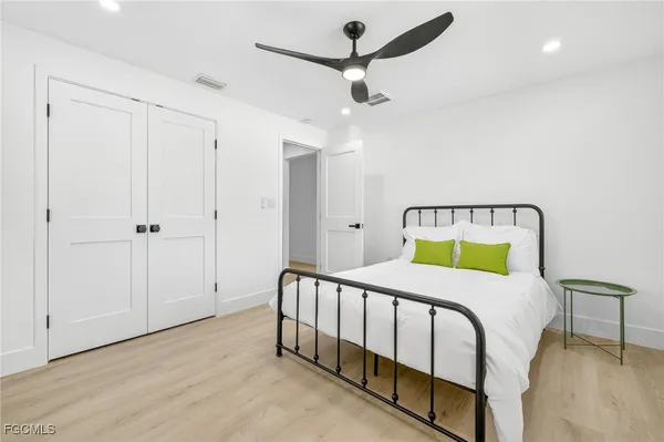 a bedroom with a bed and a table