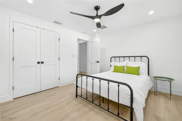 a bedroom with a bed and a table