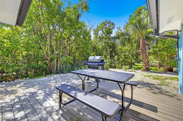 a view of a backyard with furniture