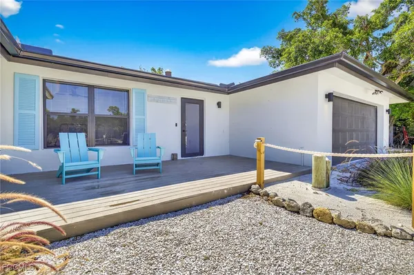 a swimming pool with an outdoor seating and yard