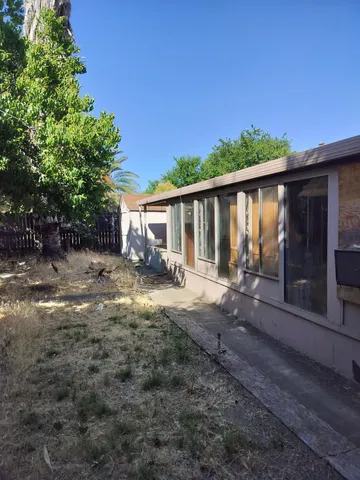a backyard of a house with lots of green space
