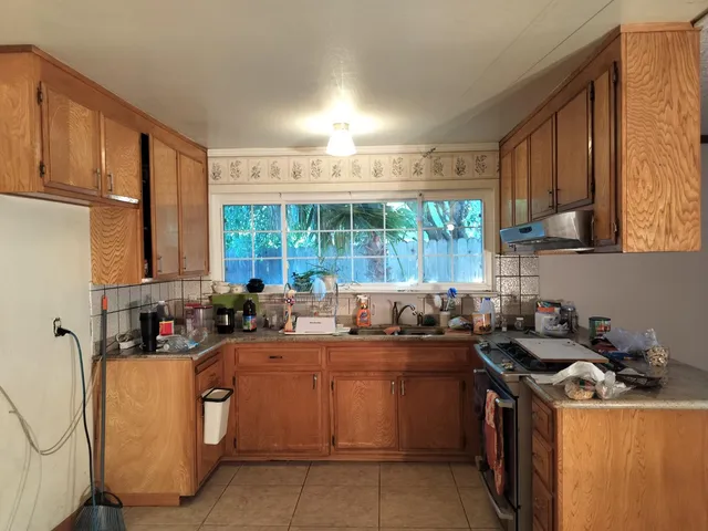 a kitchen with a stove and a microwave