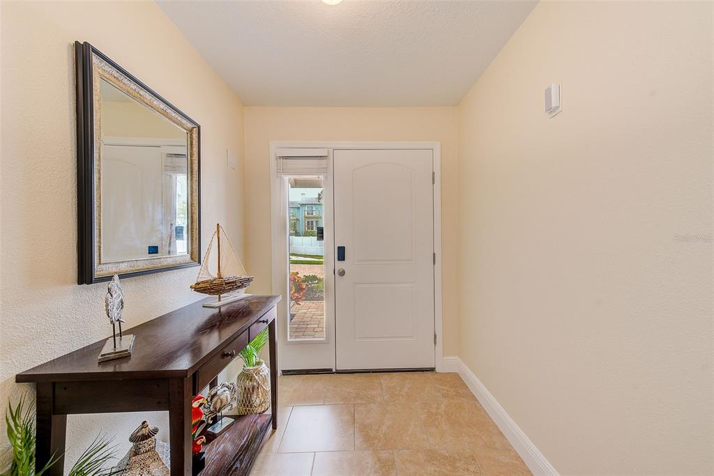 100 Windrush Boulevard, Unit 2 Indian Rocks Beach, FL 33785 - Photo 13 of 73 a bathroom with a sink a vanity and a mirror