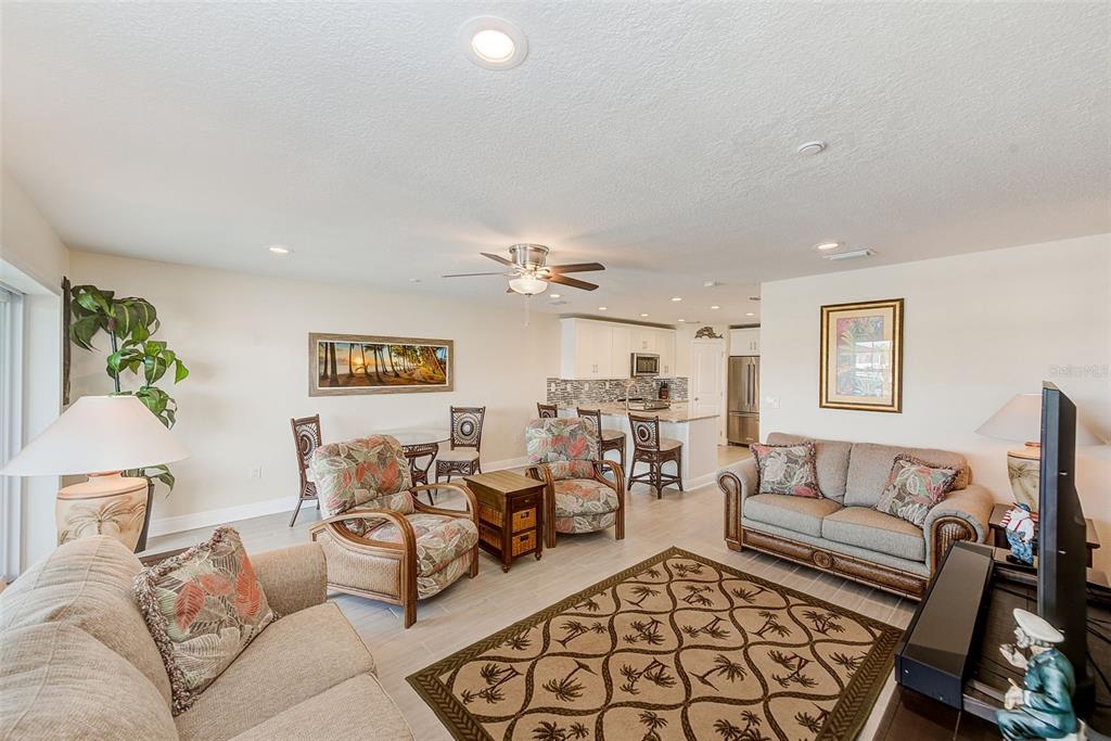 100 Windrush Boulevard, Unit 2 Indian Rocks Beach, FL 33785 - Photo 17 of 73 a living room with furniture and a couch