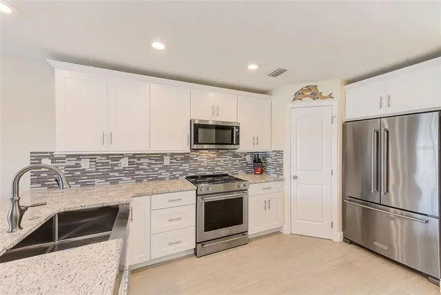 $1,050,000 | 100 Windrush Boulevard, Unit 2, Indian Rocks Beach, FL 33785