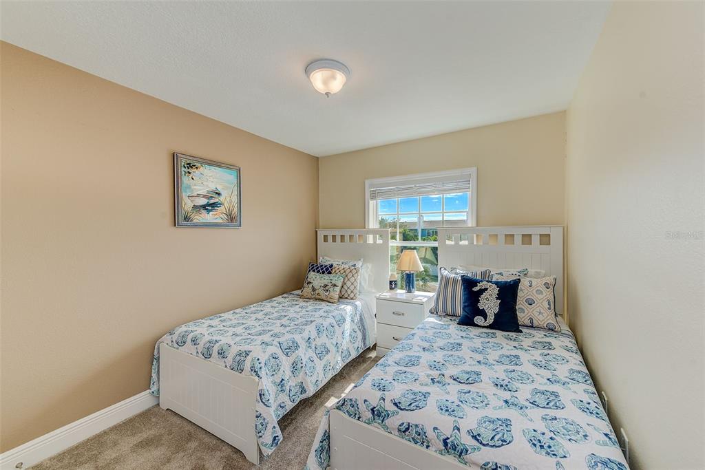 100 Windrush Boulevard, Unit 2 Indian Rocks Beach, FL 33785 - Photo 39 of 73 a living room with furniture rug and a table