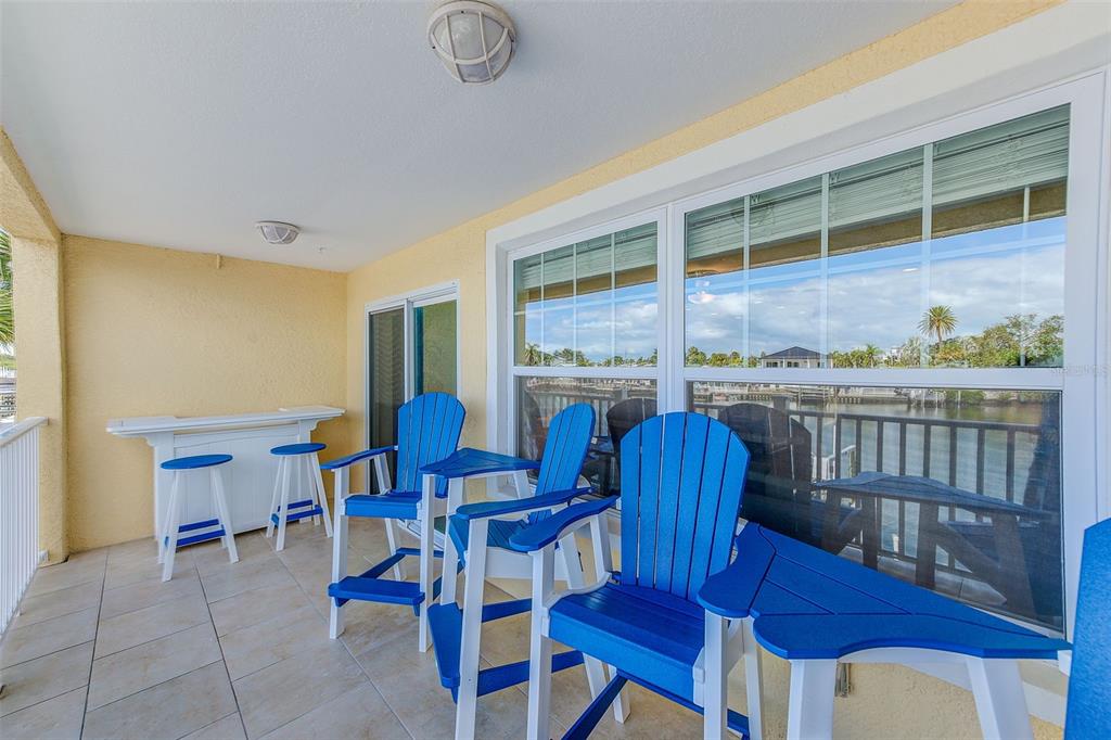 100 Windrush Boulevard, Unit 2 Indian Rocks Beach, FL 33785 - Photo 41 of 73 a view of a dining room with furniture window and wooden floor