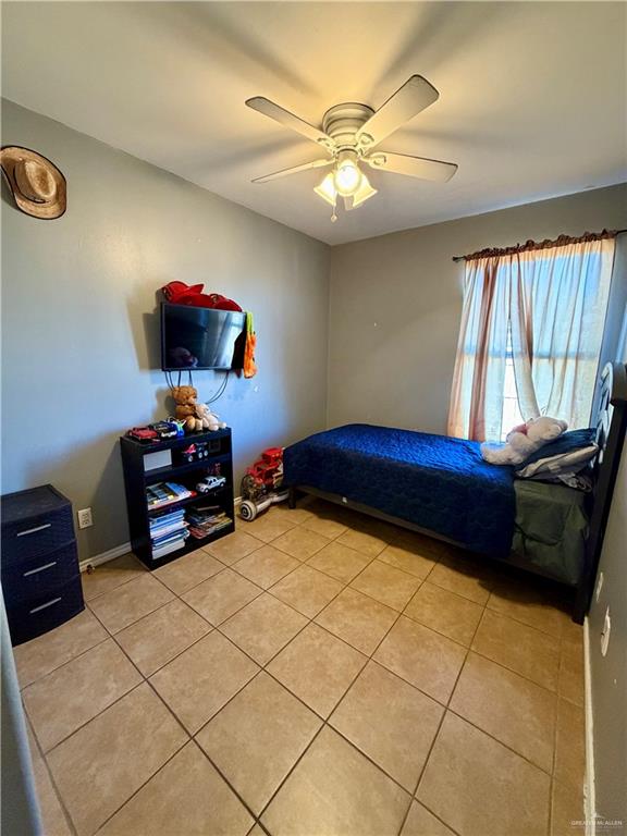 434 Serg Loop Alamo, TX 78516 - Photo 12 of 17 a bedroom with furniture and a window