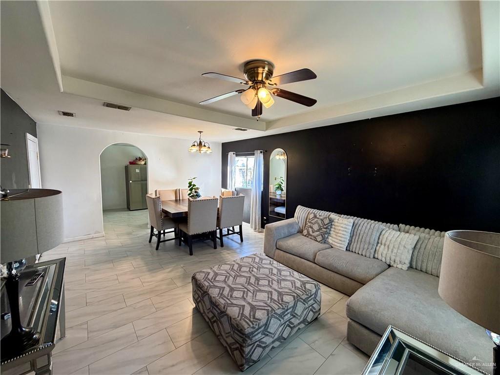 434 Serg Loop Alamo, TX 78516 - Photo 2 of 17 a living room with furniture and a chandelier