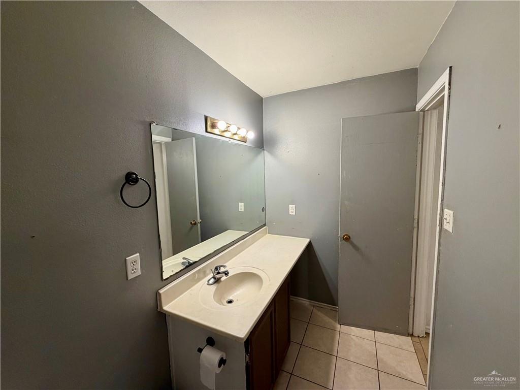 434 Serg Loop Alamo, TX 78516 - Photo 7 of 17 a bathroom with a sink mirror and toilet