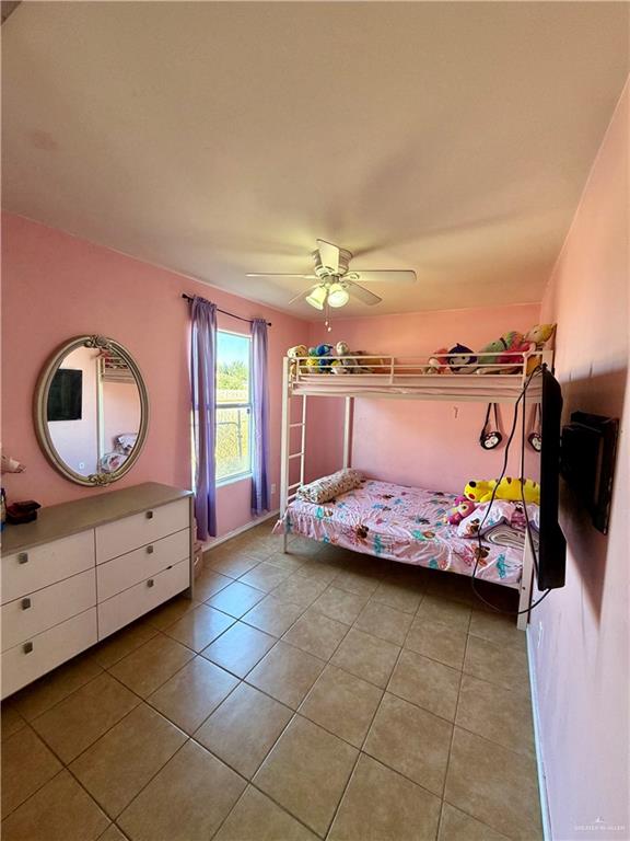434 Serg Loop Alamo, TX 78516 - Photo 10 of 17 a bedroom with a bed and a dresser