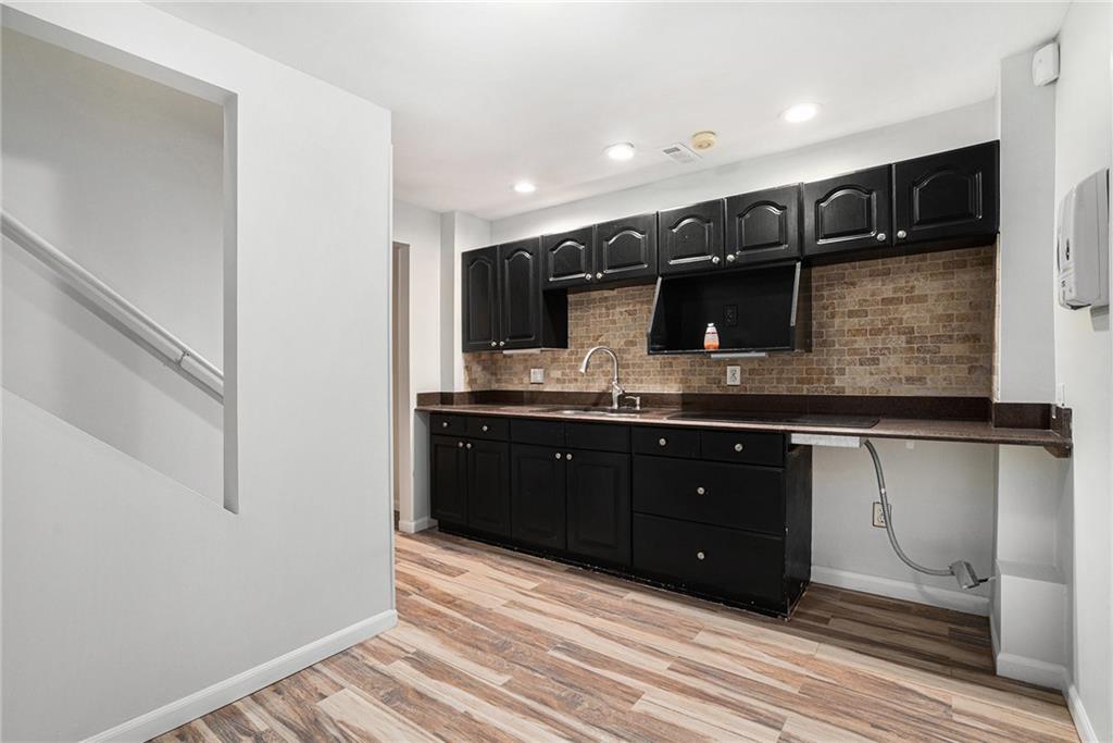 523 Sycamore Point Woodstock, GA 30189 - Photo 22 of 34 a bathroom with a sink and a mirror