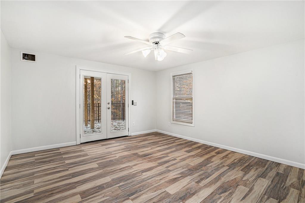 523 Sycamore Point Woodstock, GA 30189 - Photo 24 of 34 a view of an empty room with glass door