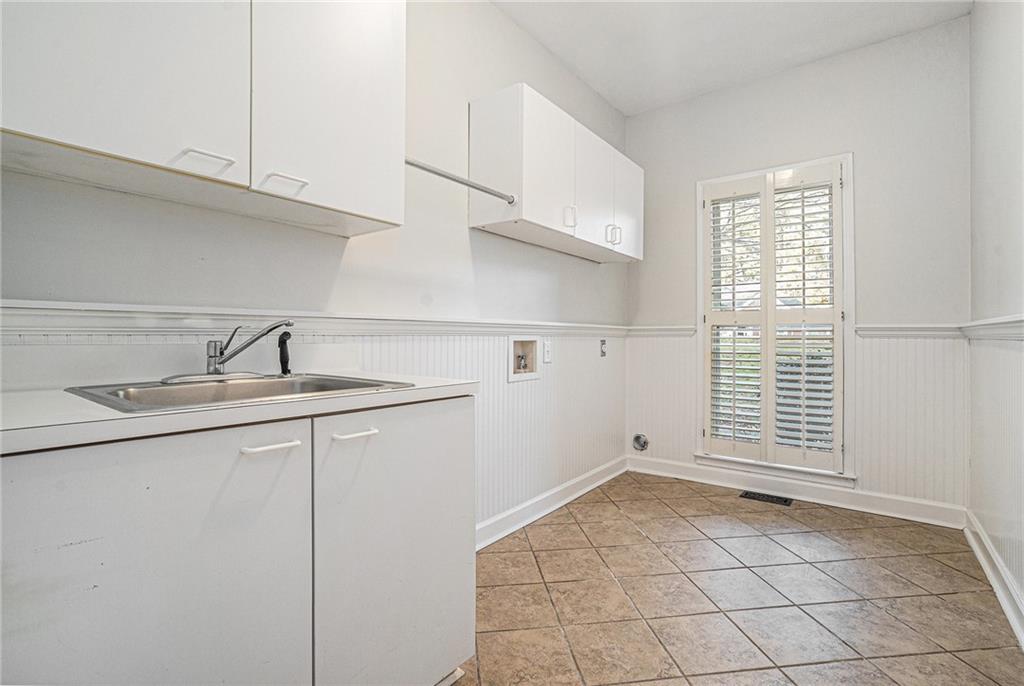 523 Sycamore Point Woodstock, GA 30189 - Photo 28 of 34 a kitchen with a sink cabinets and window