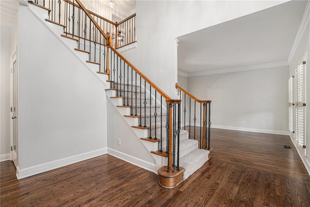 523 Sycamore Point Woodstock, GA 30189 - Photo 4 of 34 a view of entryway and hall with wooden floor