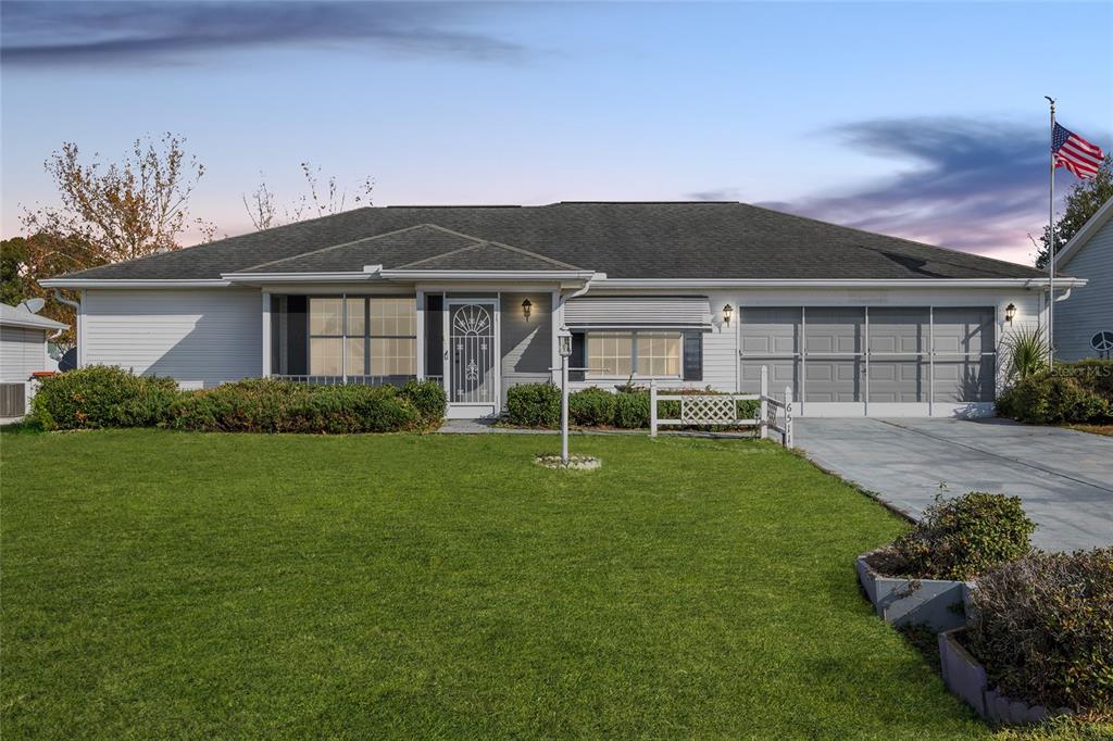 a view of a house with a backyard