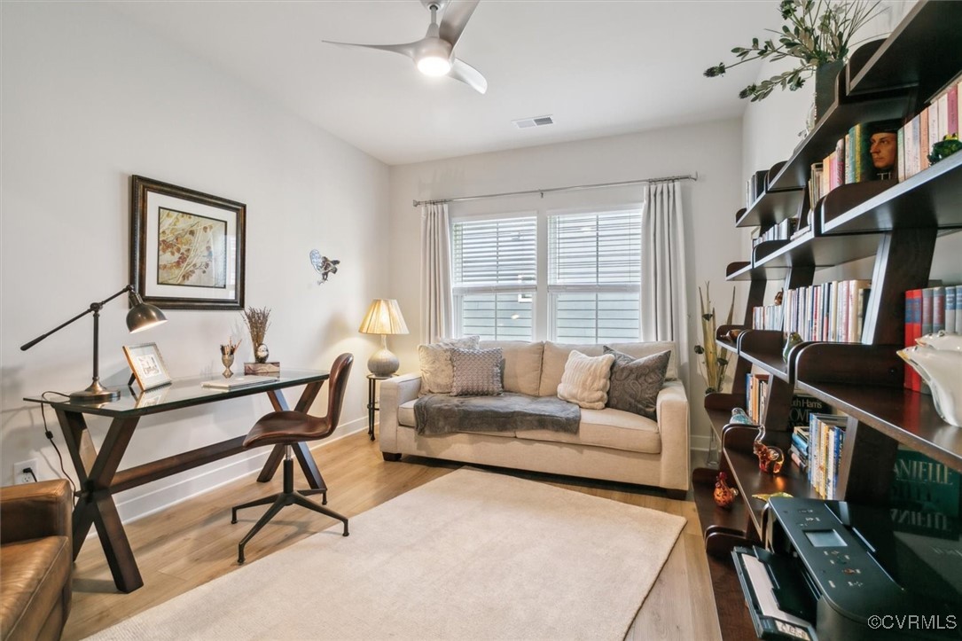 115 Apprentice Landing Williamsburg, VA 23185 - Photo 13 of 49 a living room with furniture a bookshelf and a window