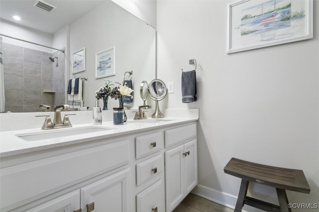 115 Apprentice Landing Williamsburg, VA 23185 - Photo 14 of 49 a bathroom with a double vanity sink and a mirror