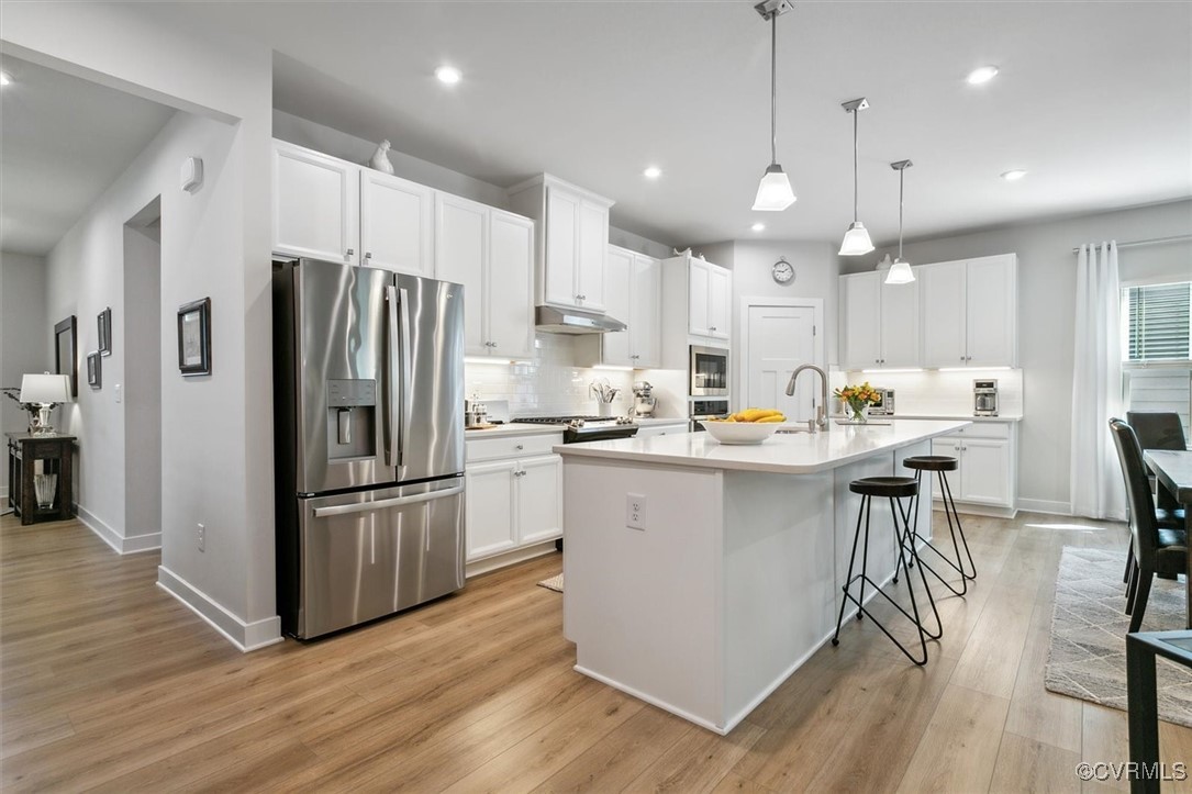 115 Apprentice Landing Williamsburg, VA 23185 - Photo 17 of 49 a kitchen with stainless steel appliances a refrigerator a stove a sink and a oven