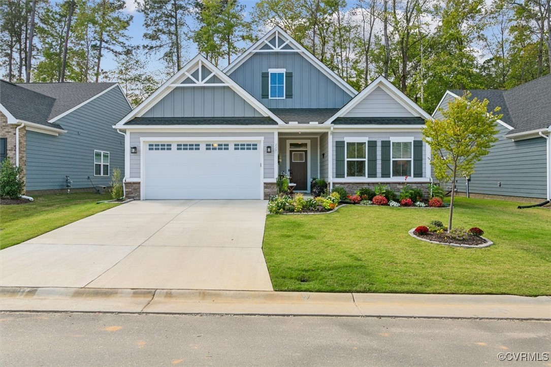 115 Apprentice Landing Williamsburg, VA 23185 - Photo 2 of 49 a front view of a house with yard and green space