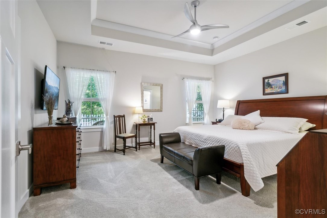 115 Apprentice Landing Williamsburg, VA 23185 - Photo 34 of 49 a bedroom with a bed and a flat tv screen on dresser