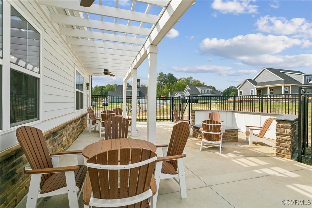 115 Apprentice Landing Williamsburg, VA 23185 - Photo 45 of 49 a view of a patio with a dining table and chairs with wooden floor