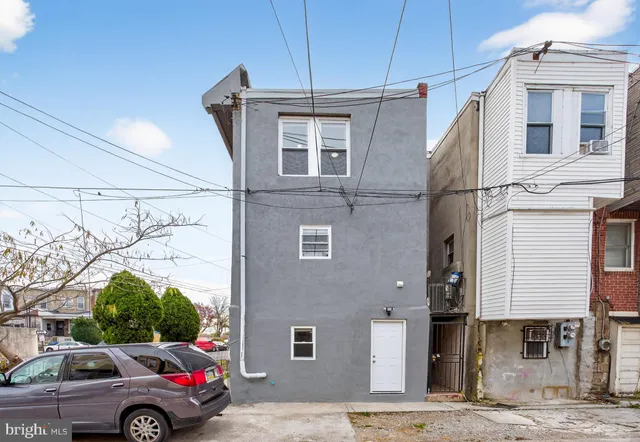 a front view of a house with parking space