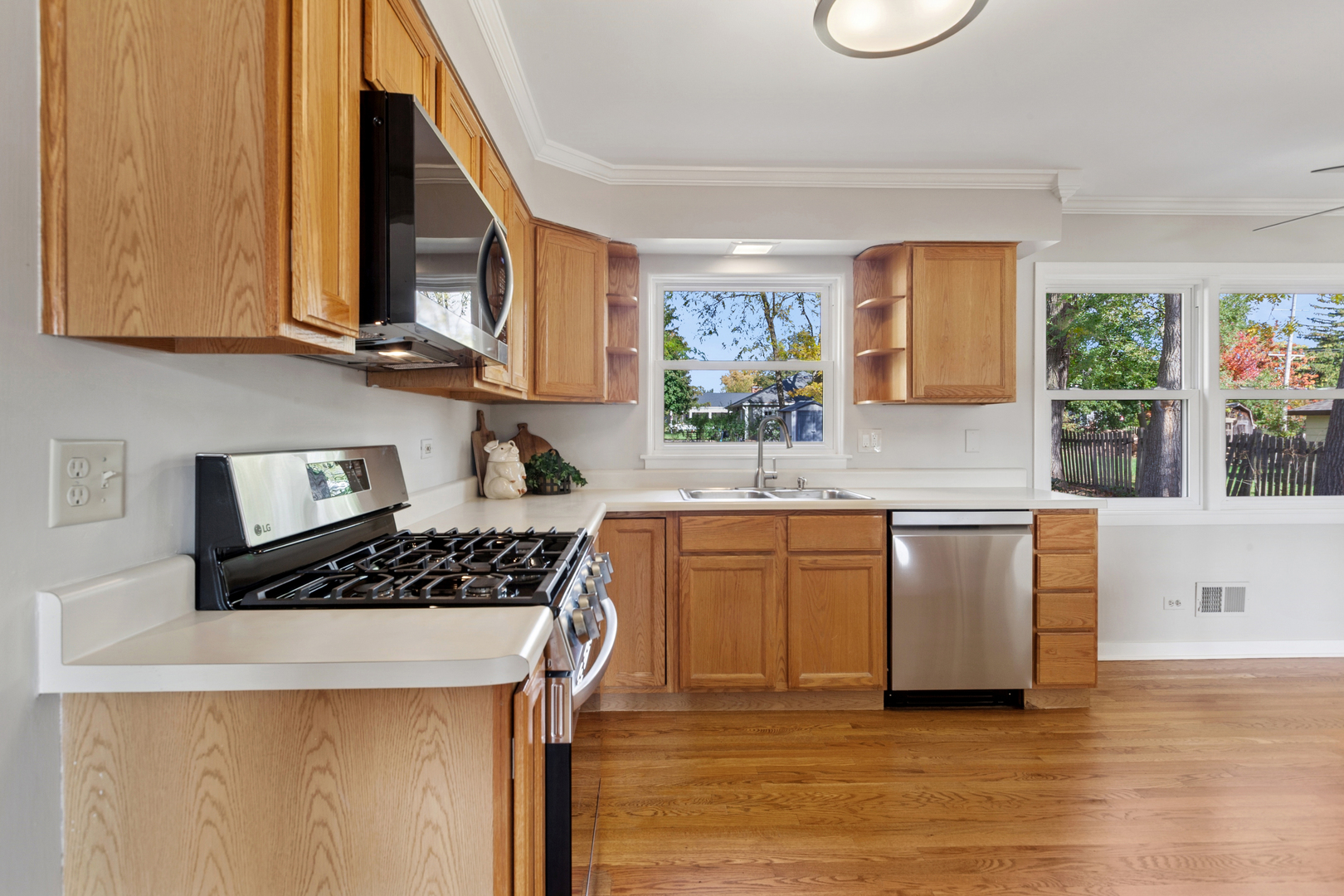 270 Hawthorne Boulevard Glen Ellyn, IL 60137 - Photo 7 of 34 a kitchen with stainless steel appliances granite countertop a stove a sink and a microwave