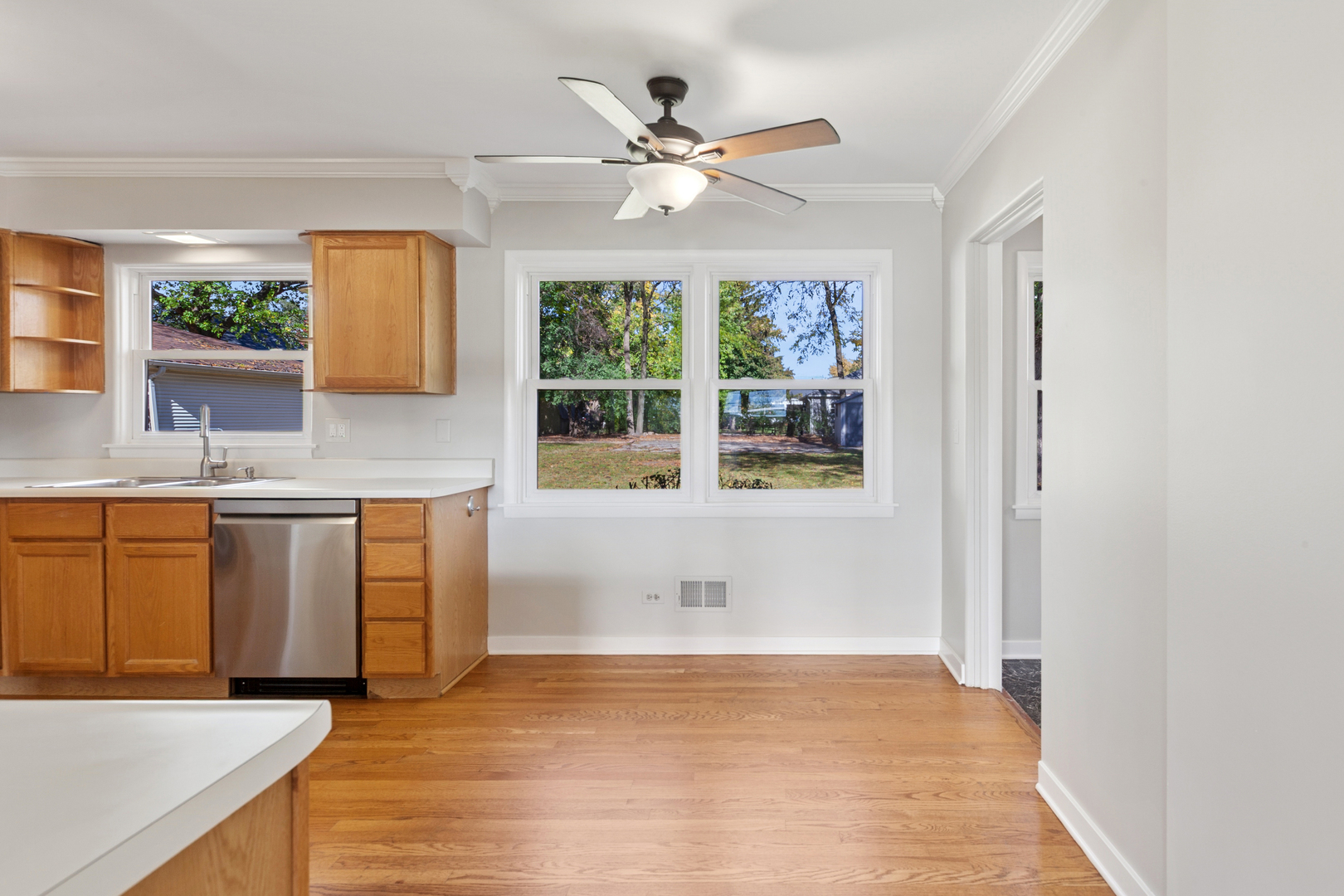 270 Hawthorne Boulevard Glen Ellyn, IL 60137 - Photo 9 of 34 a kitchen with stainless steel appliances granite countertop a sink cabinets and wooden floor