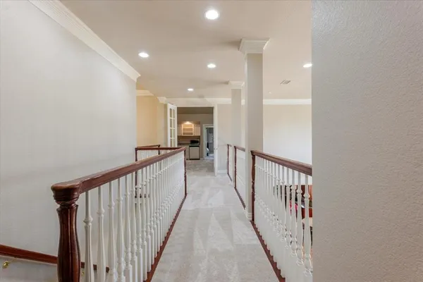 a view of gallery with wooden floor
