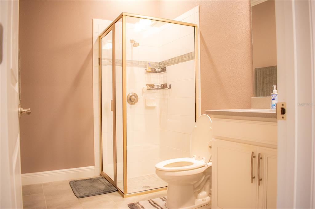 17993 Gourd Neck Loop Winter Garden, FL 34787 - Photo 17 of 29 a bathroom with a shower and a toilet