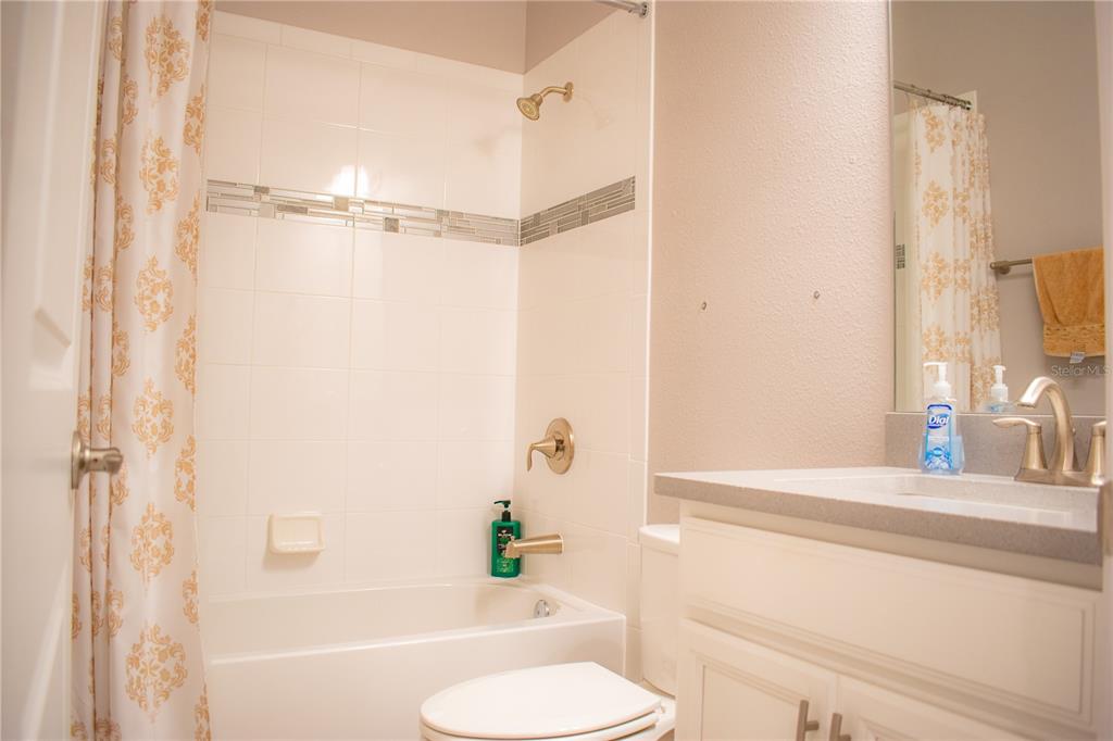 17993 Gourd Neck Loop Winter Garden, FL 34787 - Photo 21 of 29 a bathroom with a bathtub and a sink