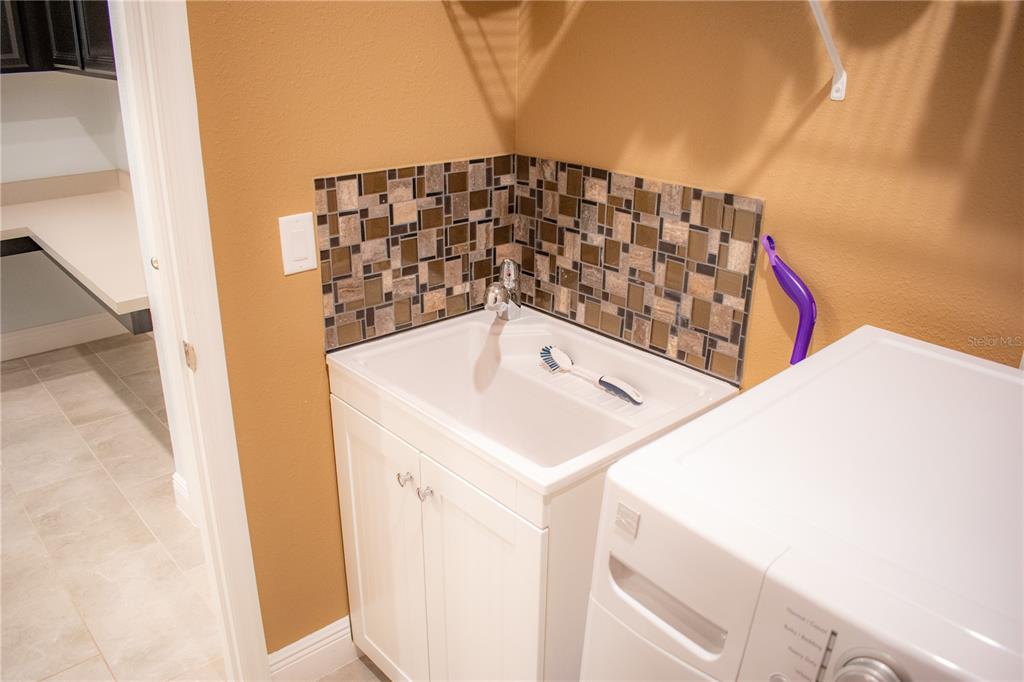 17993 Gourd Neck Loop Winter Garden, FL 34787 - Photo 23 of 29 a bathroom with a sink and a shower curtain
