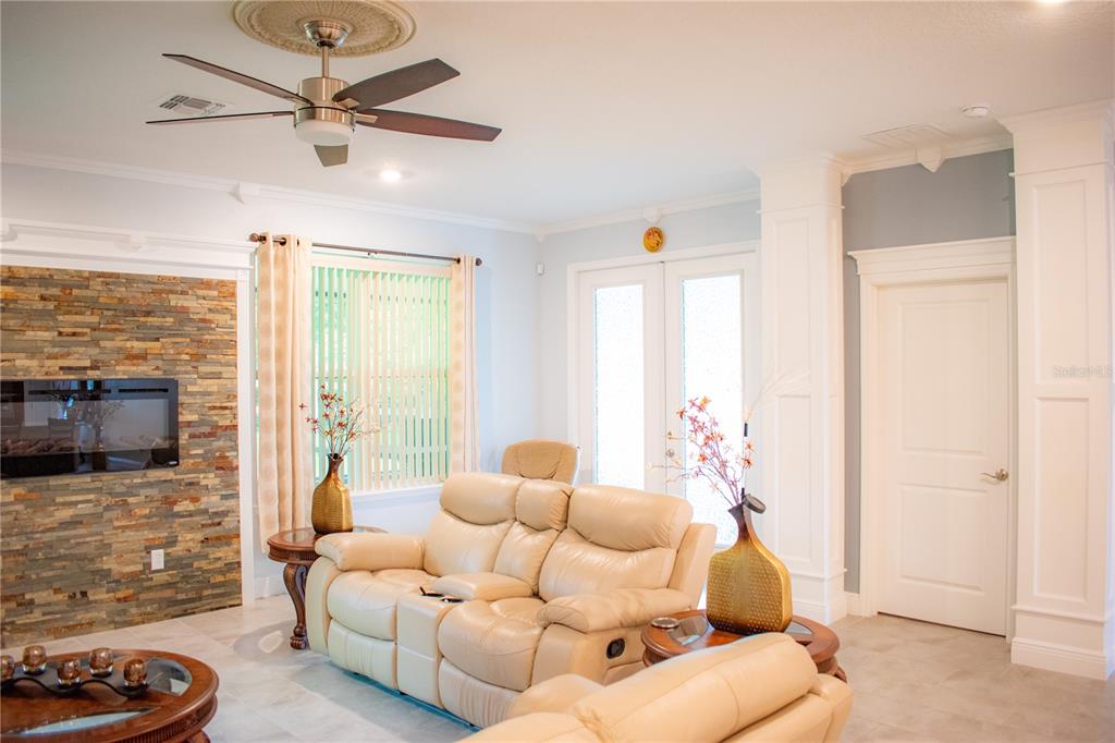 17993 Gourd Neck Loop Winter Garden, FL 34787 - Photo 8 of 29 a living room with furniture and a flat screen tv