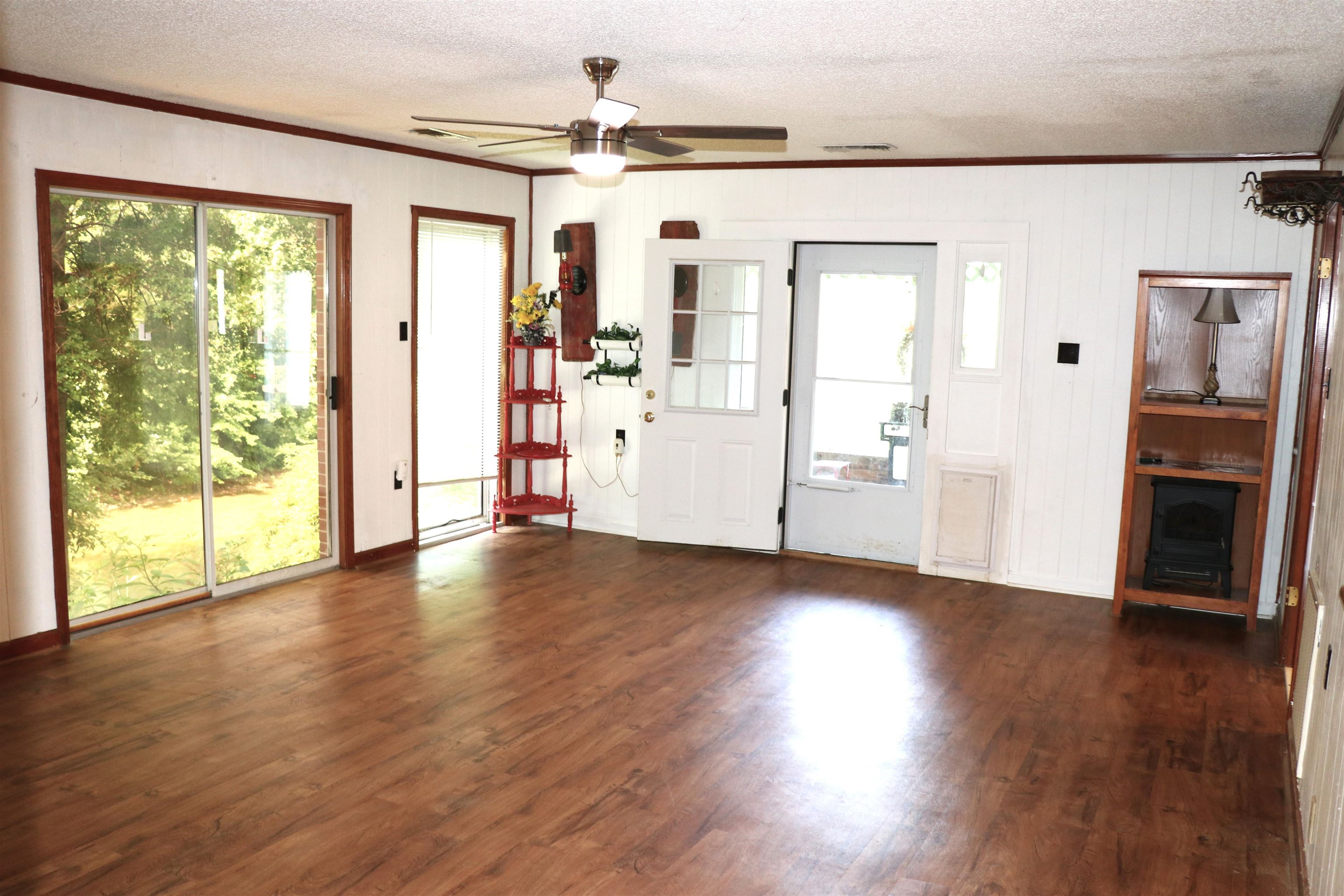 937 Kelleys Chapel Road Burlison, TN 38015 - Photo 4 of 40 Spacious interior with wood-finish flooring, white paneling, and wood trim details