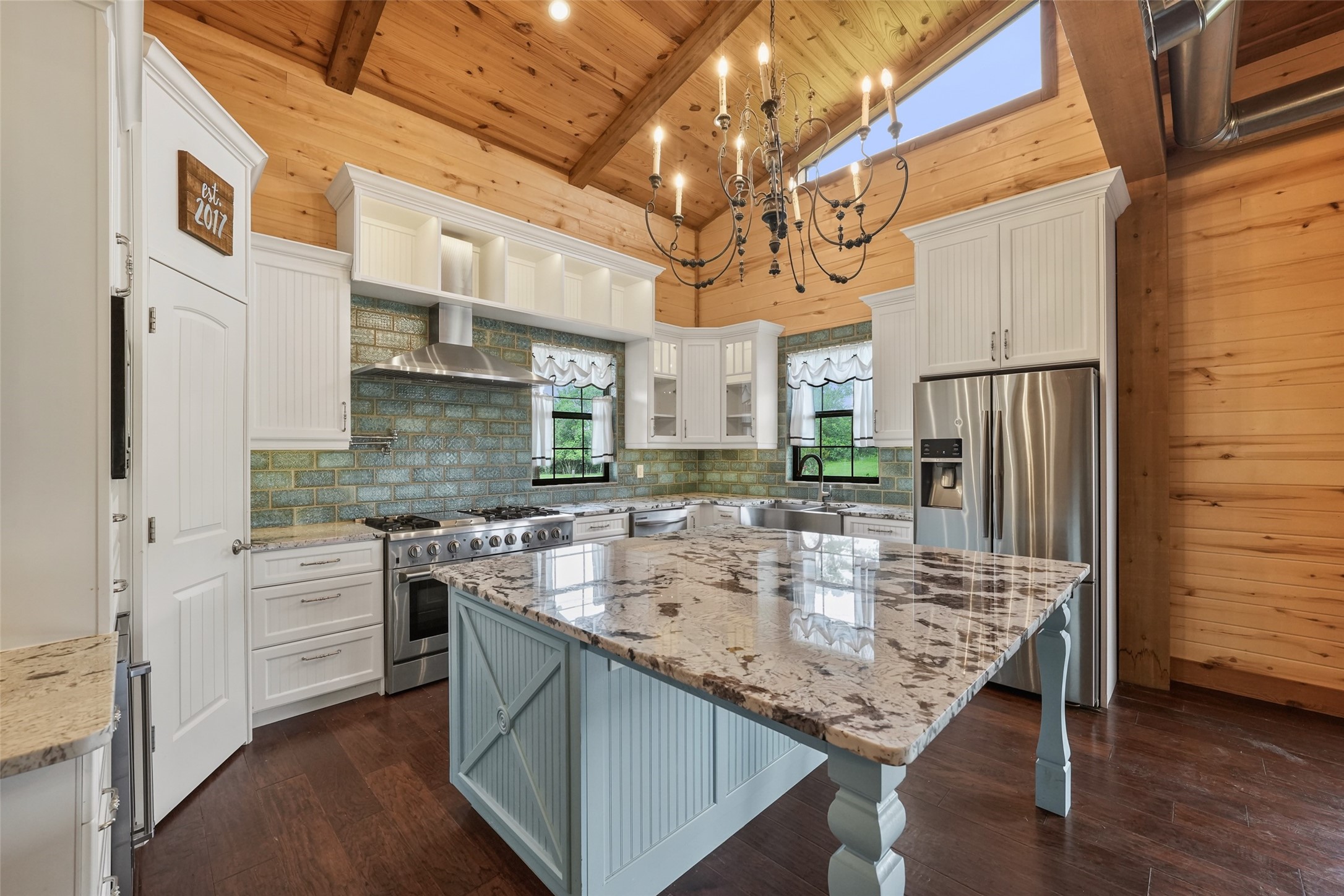 26534 Mitchell Road Hempstead, TX 77445 - Photo 11 of 45 a kitchen with cabinets and wooden floor