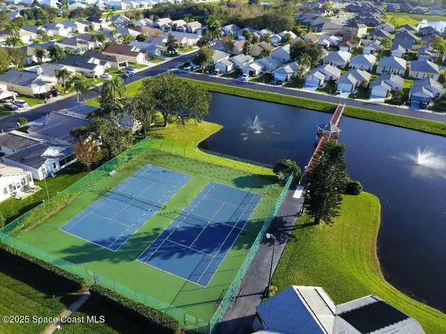 an aerial view of a pool patio outdoor seating and outdoor kitchen