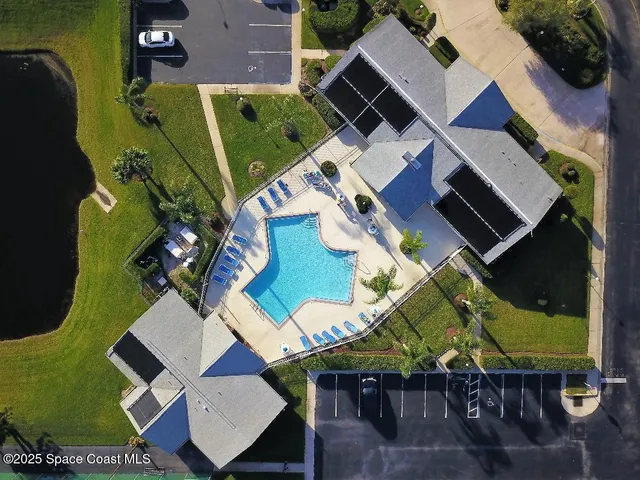 an aerial view of a house with a garden