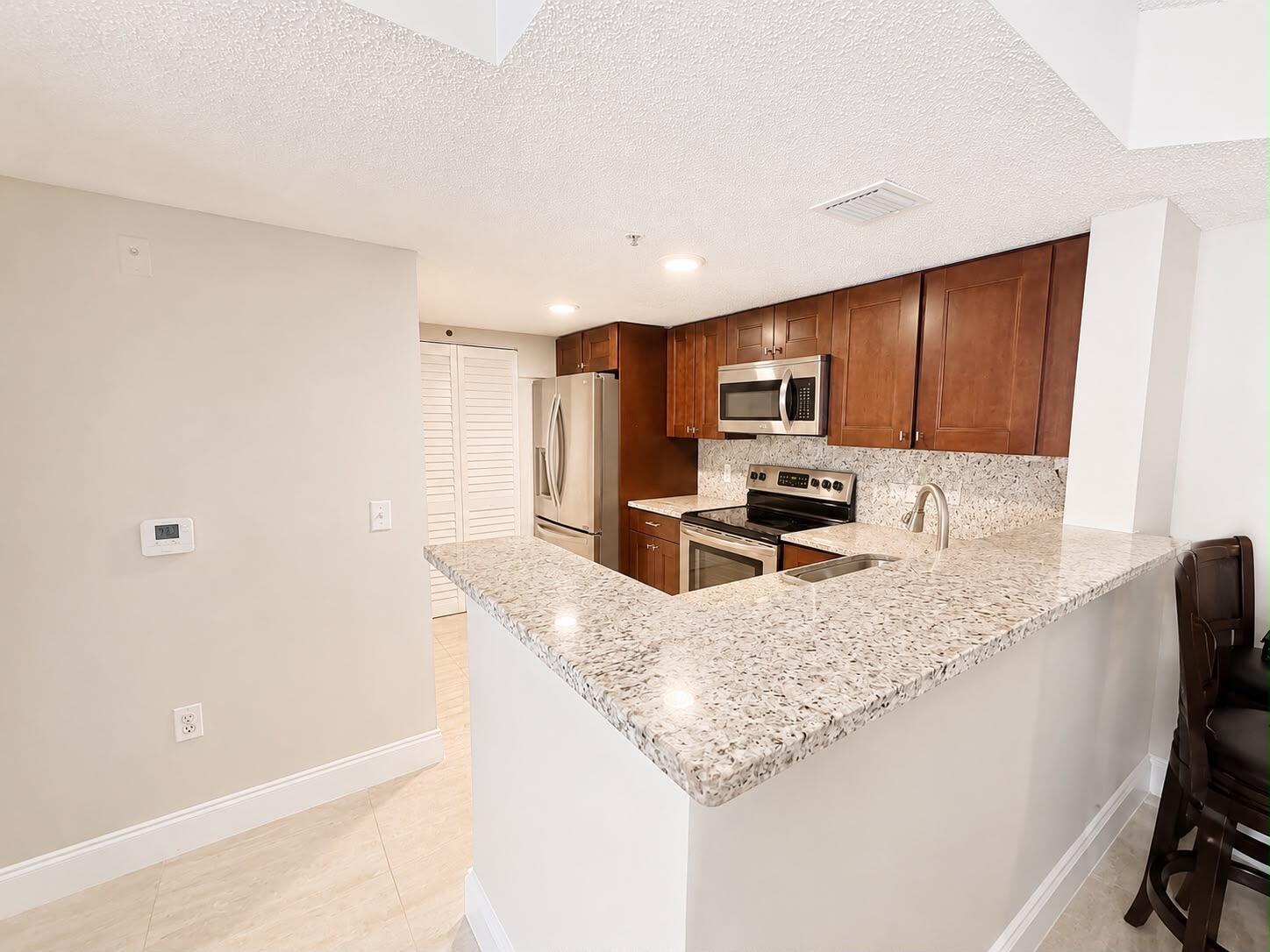 5045 Wiles Road, Unit 105 Coconut Creek, FL 33073 - Photo 4 of 13 0a5d73b0-c1c1-49b1-9fbc-dd2c275328df